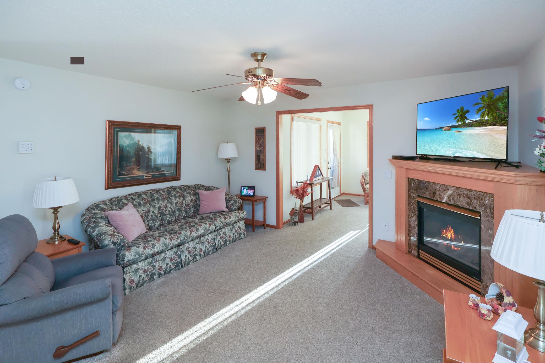 The living room leads right into the sunroom.