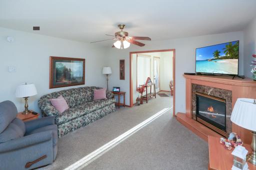 The living room leads right into the sunroom.