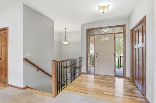 Newly refinished gleaming wood floors will greet you in the front foyer.