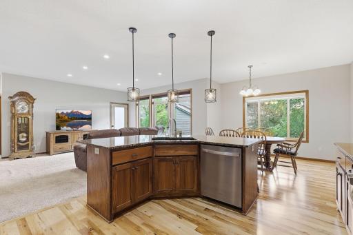 The center island has the sink and dishwasher built in and offers more counter space for preparing and serving food.
