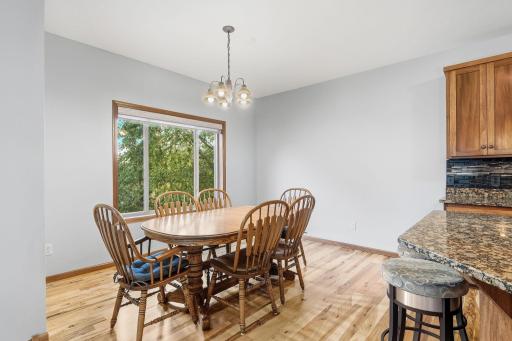 Spacious dining area offers plenty of room to comfortably gather a larger family.