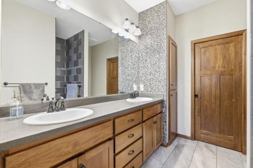 Convenient double sinks in the private primary bath.
