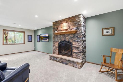 The gas fireplace makes a great focal point for the lower level