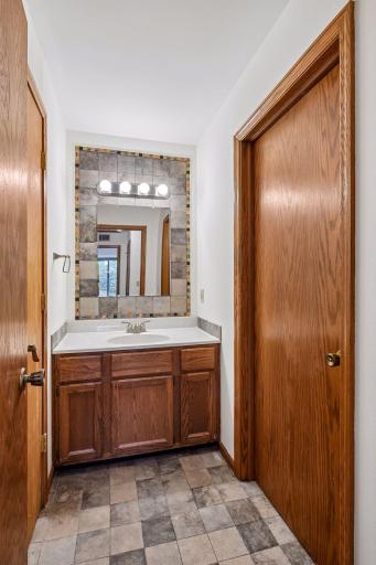 The full bath with the door closed on the left, laundry room to the right.