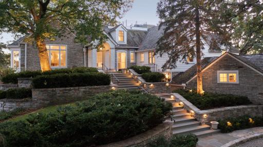 Gracious main entry to the home, approached by a circular paver drive. Staircase heated in winter.