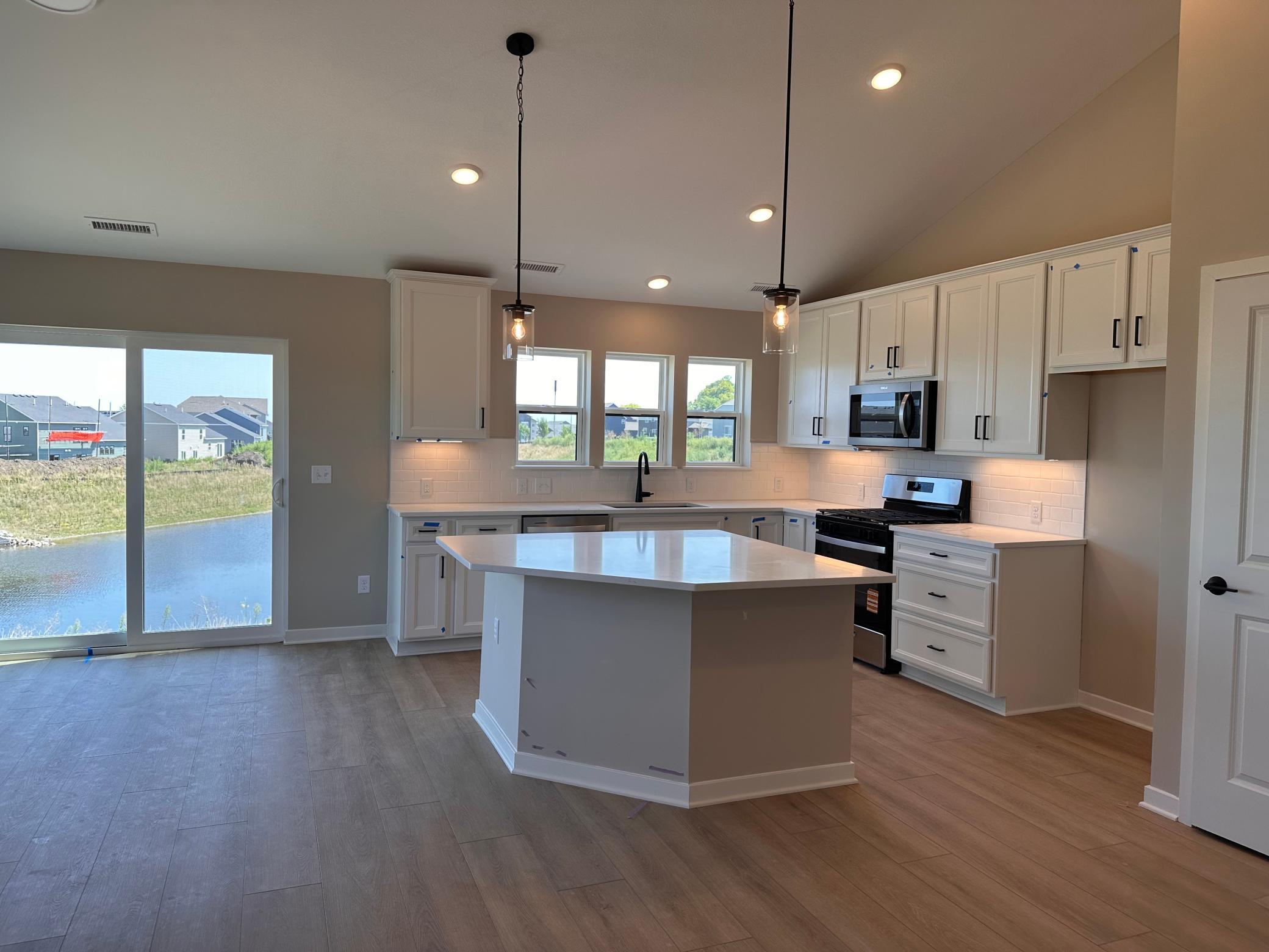 Main Floor- Kitchen Overlooking Pond