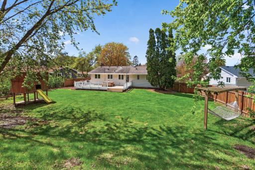 Step outside and discover your own private backyard retreat. A sprawling yard, a large deck perfect for entertaining, a play fort, and even a pre-installed hammock spot just waiting for a lazy afternoon.