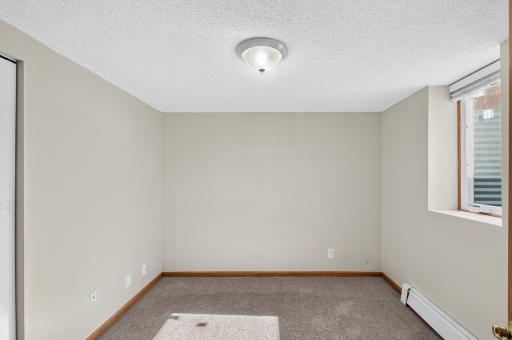 Bedroom or home office? This lower level room features an egress window and the versatility to be whatever you need it to be.