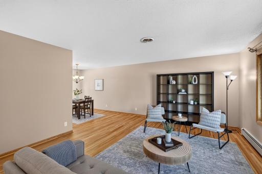Fall in love with the rich, gleaming hardwood floors (just refinished) that flow throughout the home and elevate every room.