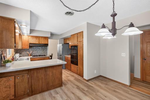 Start your mornings right! This freshly painted kitchen features a welcoming eat-in area, perfect for casual dining and everyday living.