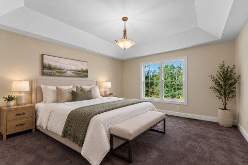 Generously sized primary suite with tray ceilings Private en suite with double sinks walk in shower and big walk in closet