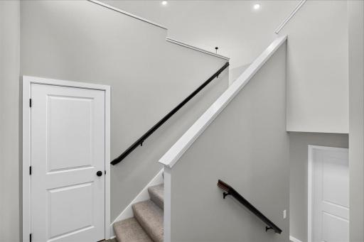 Foyer. Photo taken of another home with similar plan and finishes.