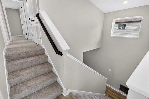 Foyer. Photo taken of another home with similar plan and finishes.