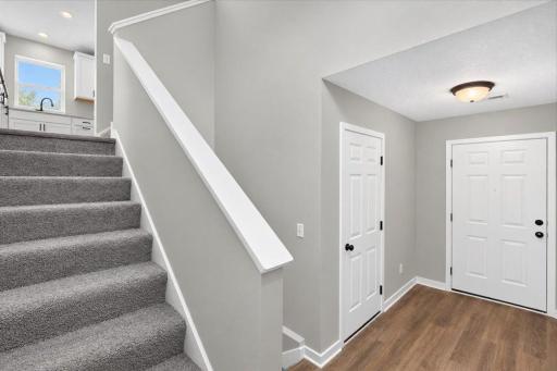 Foyer. Photo taken of another home with similar plan and finishes.