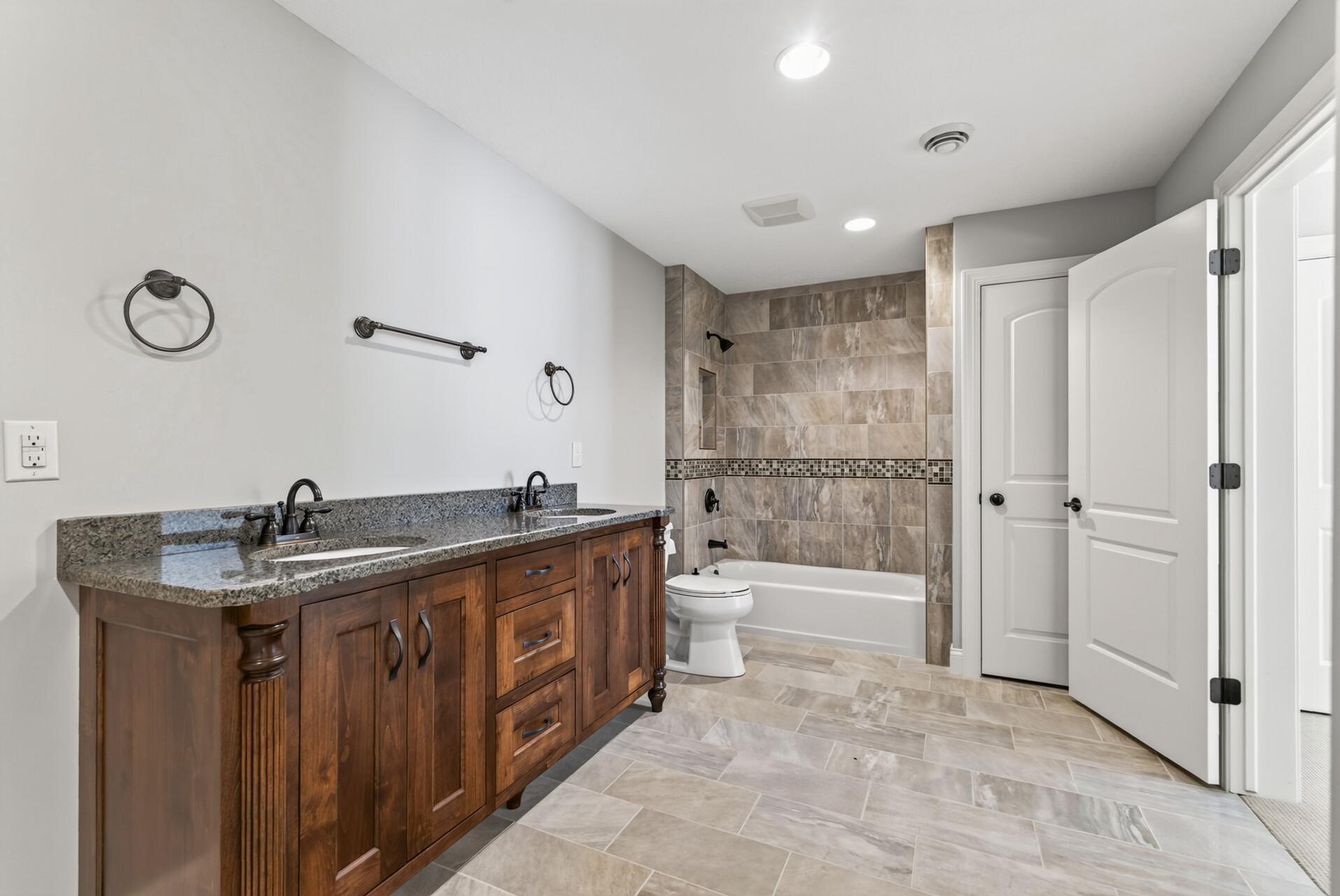 A full bathroom completes the lower level, allowing guests to enjoy a comfortable and private space of their own.