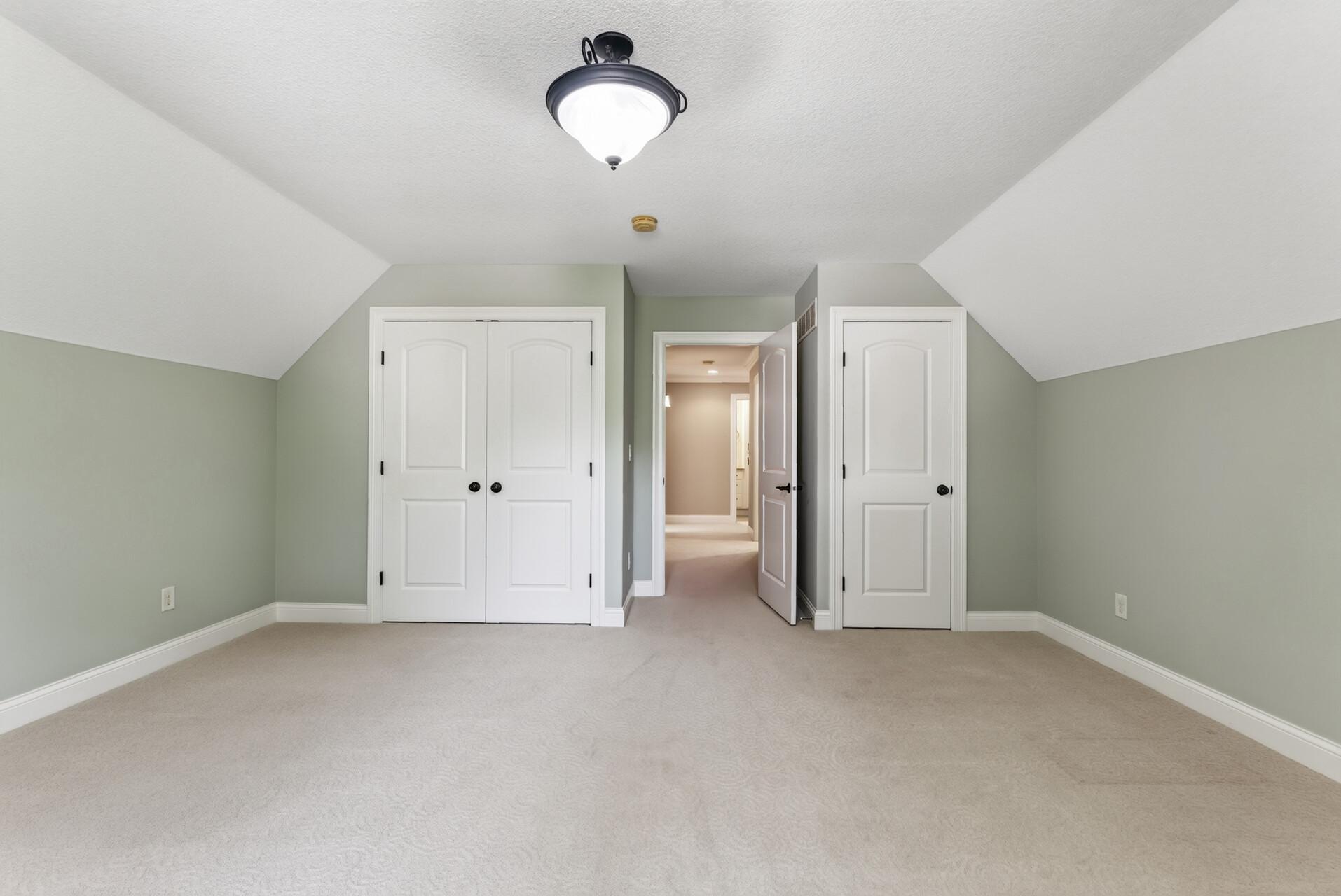 Two separate closets provide exceptional storage for this spacious bedroom, adding even more function to an already impressive space.