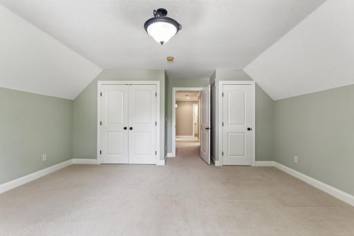 Two separate closets provide exceptional storage for this spacious bedroom, adding even more function to an already impressive space.