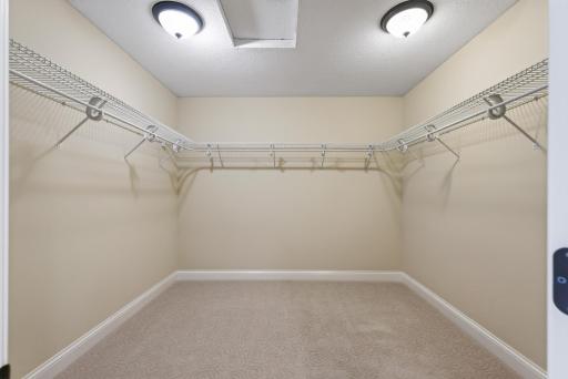 A spacious walk-in closet offers exceptional storage and organization, while a second walk-in closet provides even more roomâanother thoughtful luxury within the primary suite.