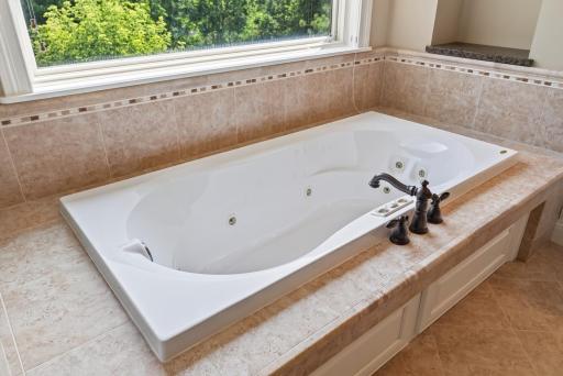 Unwind in the jetted soaking tub, creating a peaceful, spa-inspired retreat designed for relaxation at the end of the day.