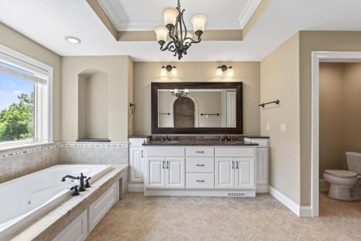 A spacious double vanity offers plenty of room to begin and end the day, combining beautiful finishes with the everyday luxury of separate spaces.