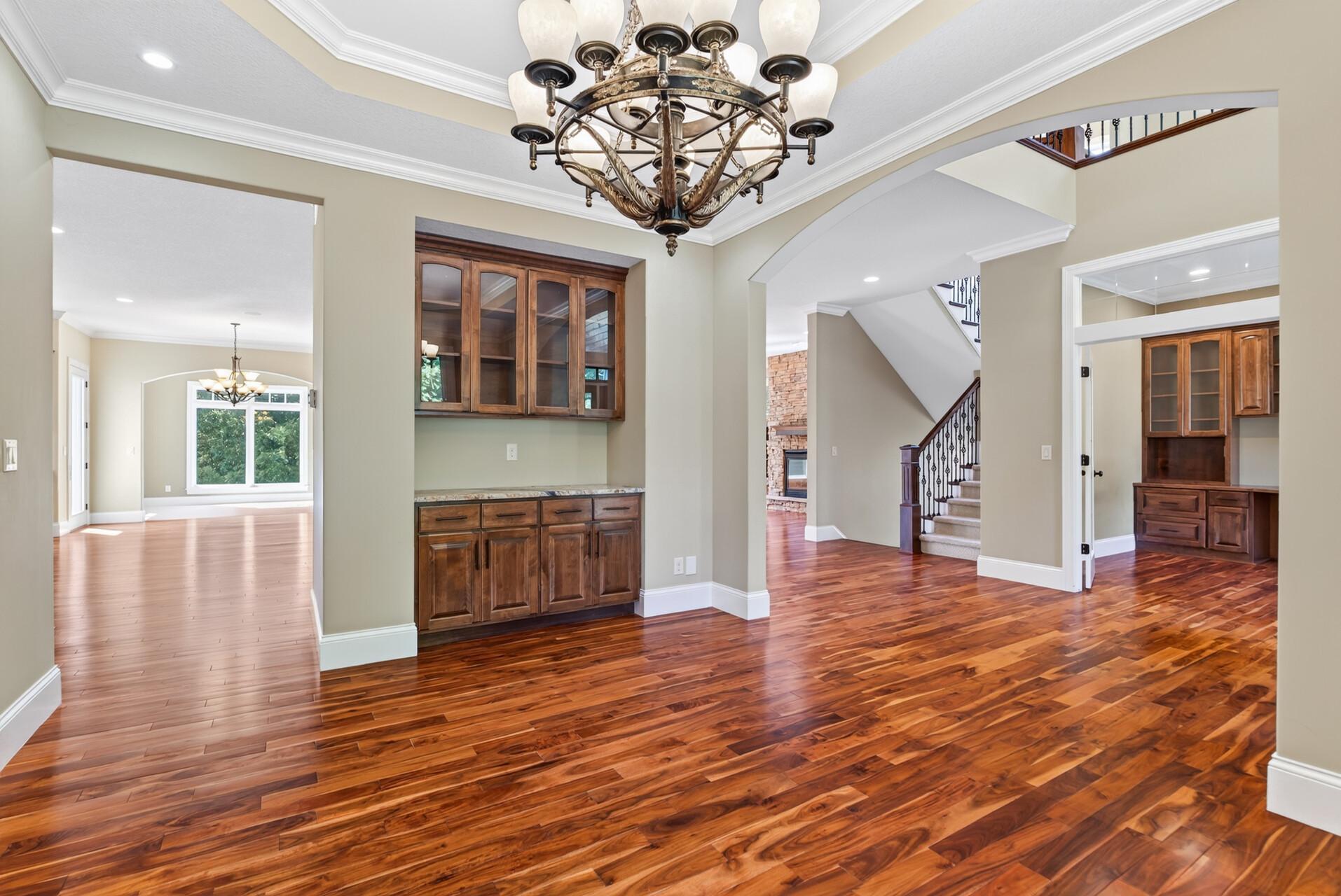 Glass-front built-in cabinetry adds both beauty and function to the formal dining room, offering the perfect place to display treasured pieces while elevating the space.