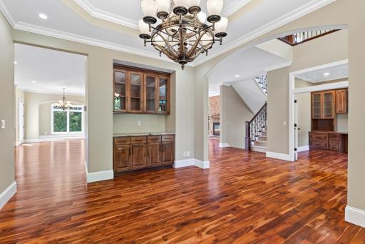 Glass-front built-in cabinetry adds both beauty and function to the formal dining room, offering the perfect place to display treasured pieces while elevating the space.