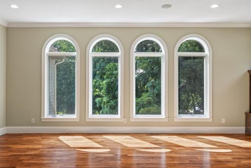 Natural light pours through oversized windows, adding to the homeâs open and airy feel.