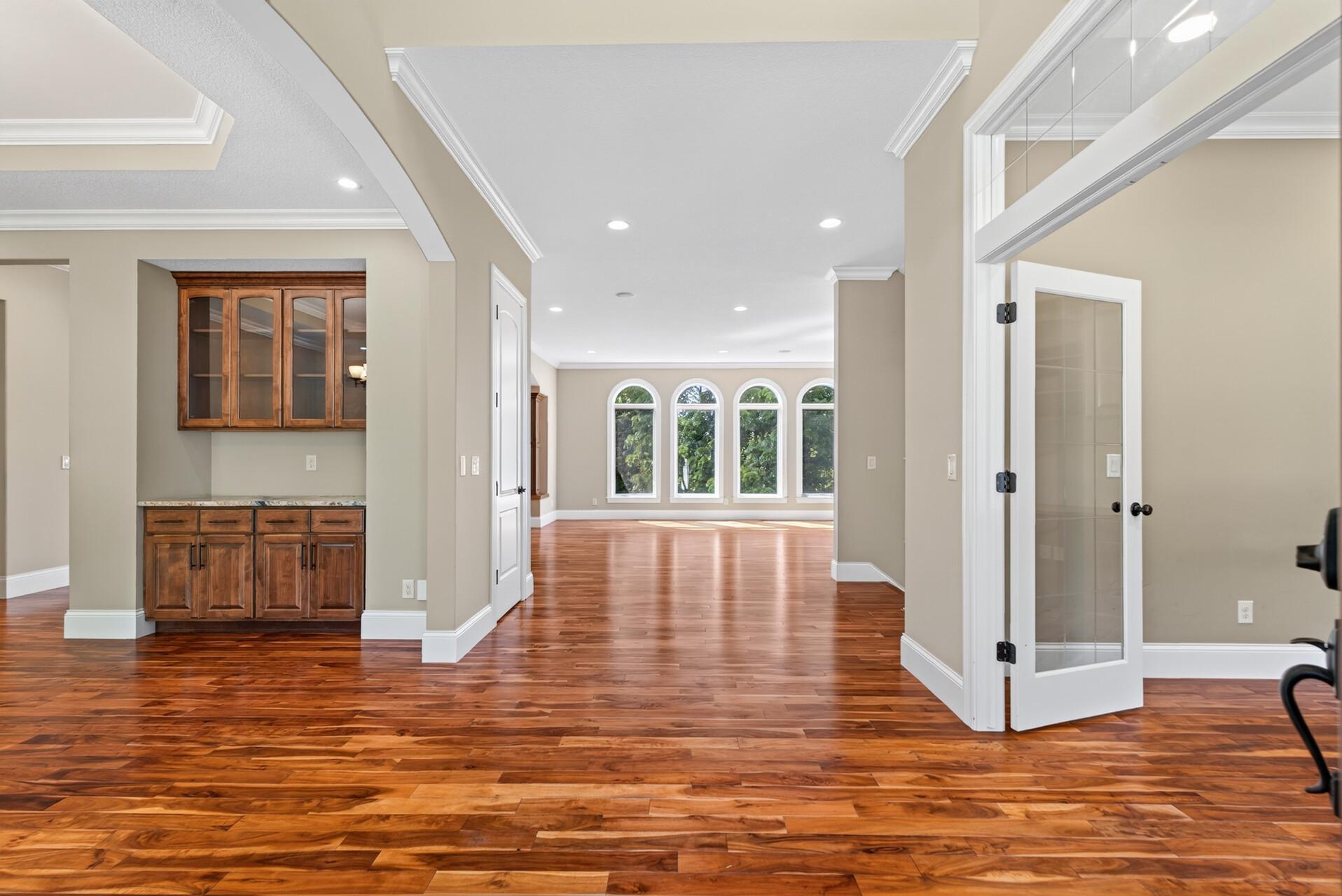 Arched openings, beautiful millwork and soaring spaces introduce the elevated finishes found throughout.