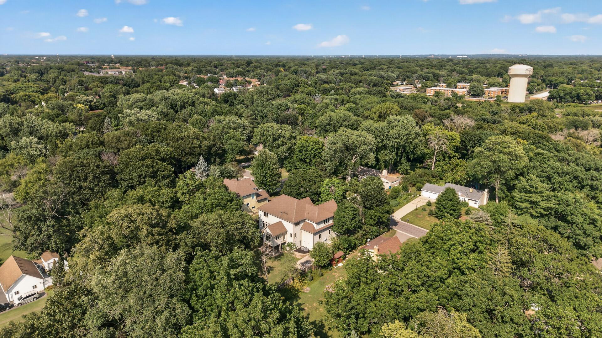 A canopy of mature trees gives the property an inviting, private feel and creates a beautiful backdrop throughout the seasons.