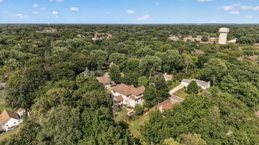 A canopy of mature trees gives the property an inviting, private feel and creates a beautiful backdrop throughout the seasons.