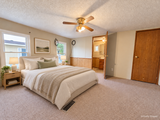 (virtually staged) Primary bedroom with private bath