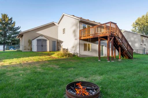 The rear yard is fenced and has a storage shed.