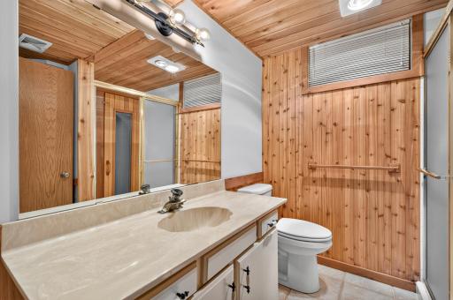 The lower level 3/4 bath located directly across from bedroom, perfect for guests.