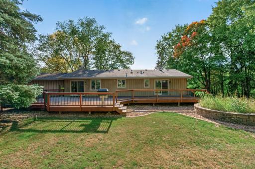 With the fenced-in yard, let the kids and pets run around while you take it easy on the deck.
