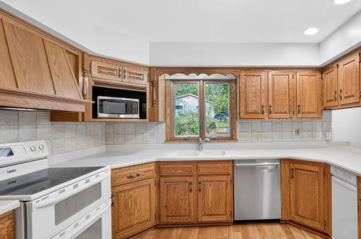 Look out to the backyard through the kitchen window and check on the outdoor activities.