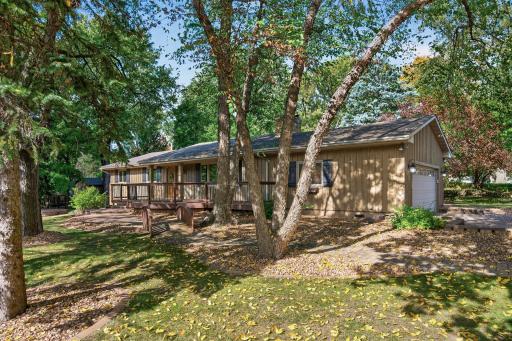 A large rambler with fully finished basement sits on a .6 acre lot.