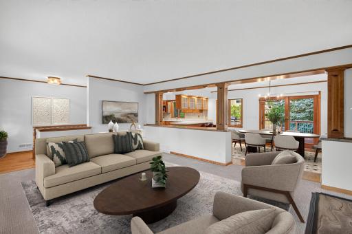 Virtually staged living room and dining room.