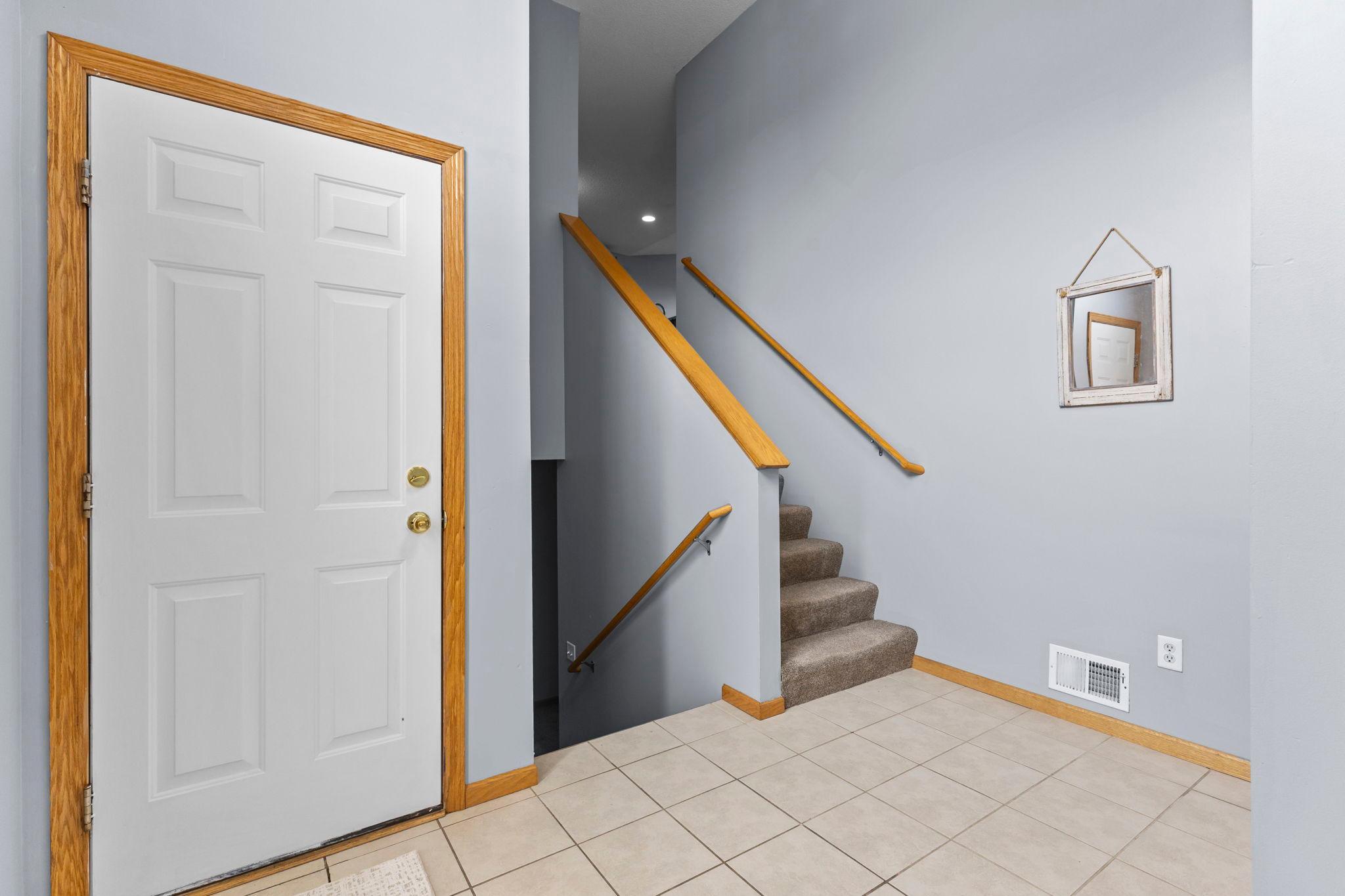 Large welcoming foyer with storage