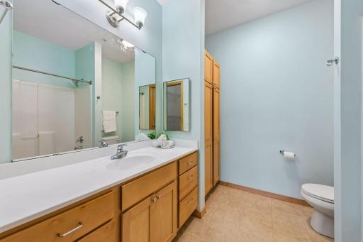 Private primary bathroom with a large vanity, plenty of cabinet storage, and full-size mirror.