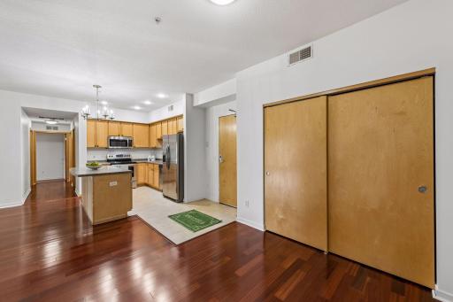 Another view of the dedicated dining area conveniently positioned next to the kitchen, with generous closet storage and easy access to the main living space.