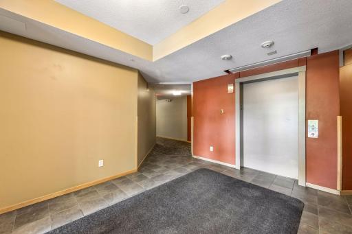 Convenient secondary building entrance with elevator access, located close to the unit for a shorter, easier route home.