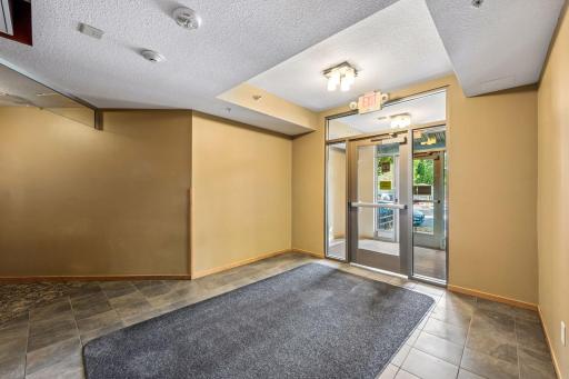 Another view of the secondary entrance, offering convenient access just steps from the elevator and unit.