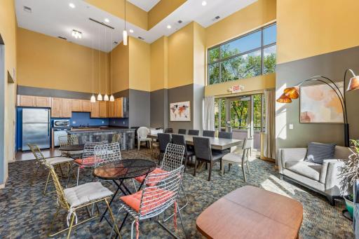 Community party room includes a kitchen area and flexible space for entertaining, gatherings, or larger celebrations.