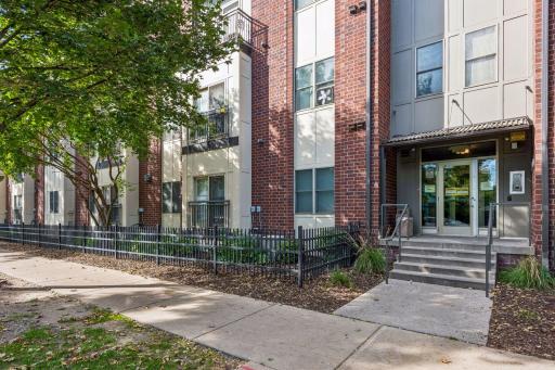 Building exterior and secondary entrance, highlighting another convenient access point to the building.