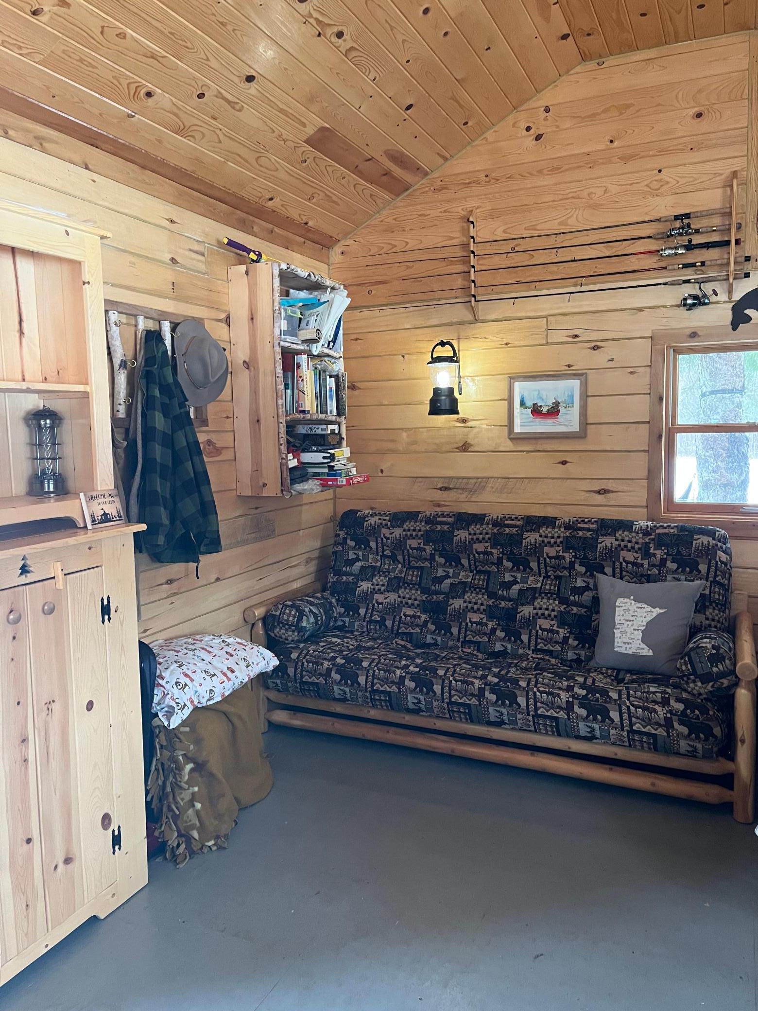 Cabin Interior 3 queen size futon with shelves and cabinet.jpeg