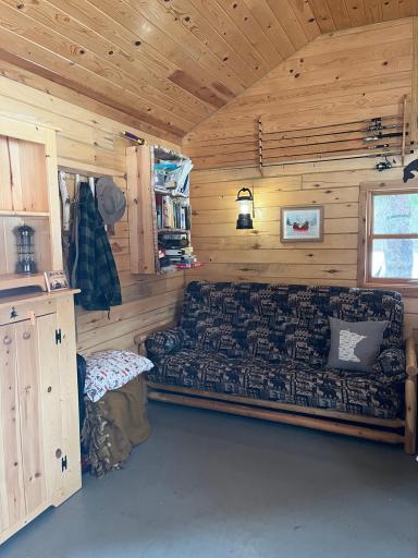 Cabin Interior 3 queen size futon with shelves and cabinet.jpeg