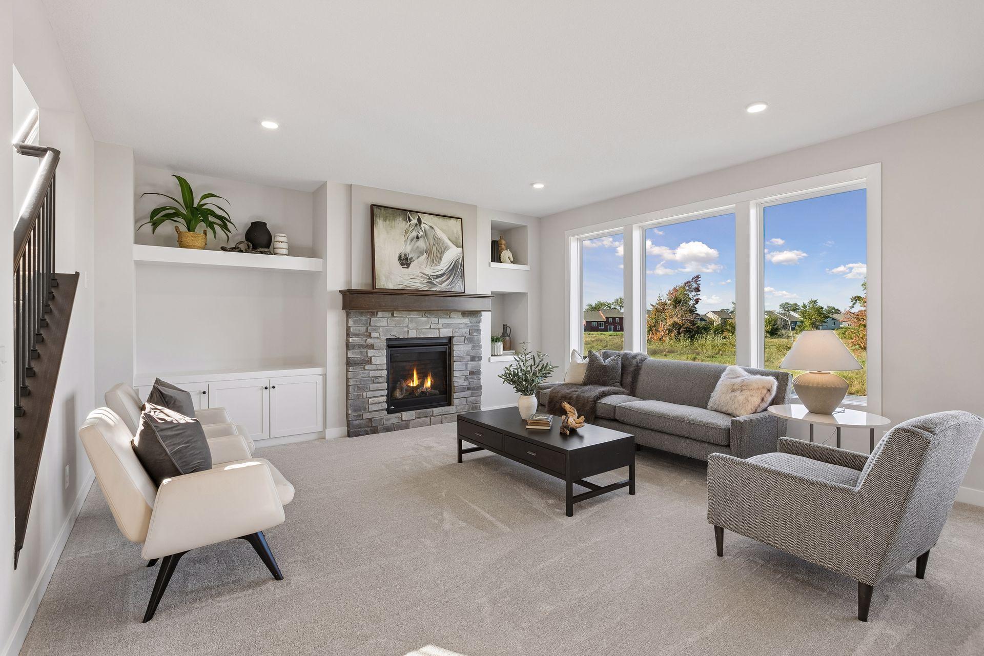 The living room on the main floor has a beautiful gas fireplace and wall built-ins.