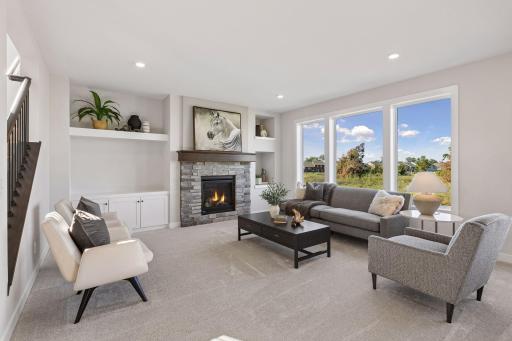 The living room on the main floor has a beautiful gas fireplace and wall built-ins.