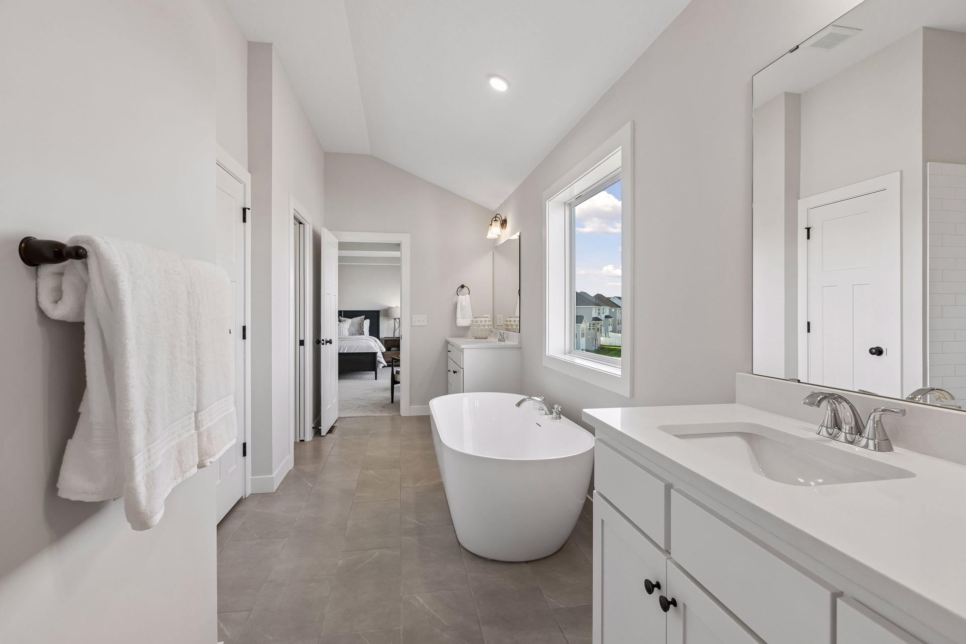 The luxurious, private bath comes with a freestanding tub.