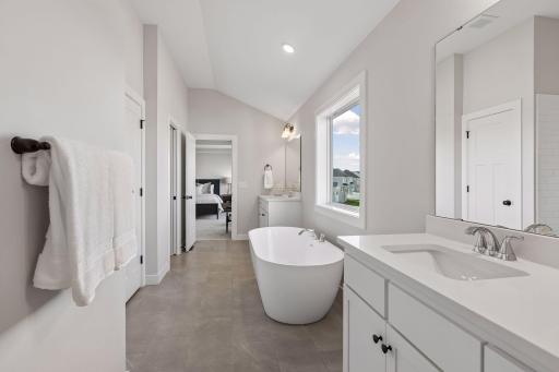 The luxurious, private bath comes with a freestanding tub.